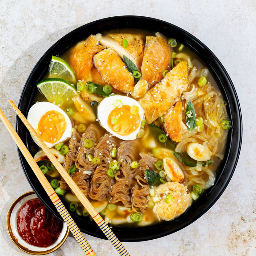 An image of prepared Caramelized Onion & Turkey Ramen made with onion, egg, Pacific Foods® Organic Free Range Chicken Broth, garlic, brown rice ramen noodles, turkey, miso, green onion, sage and sesame seeds.