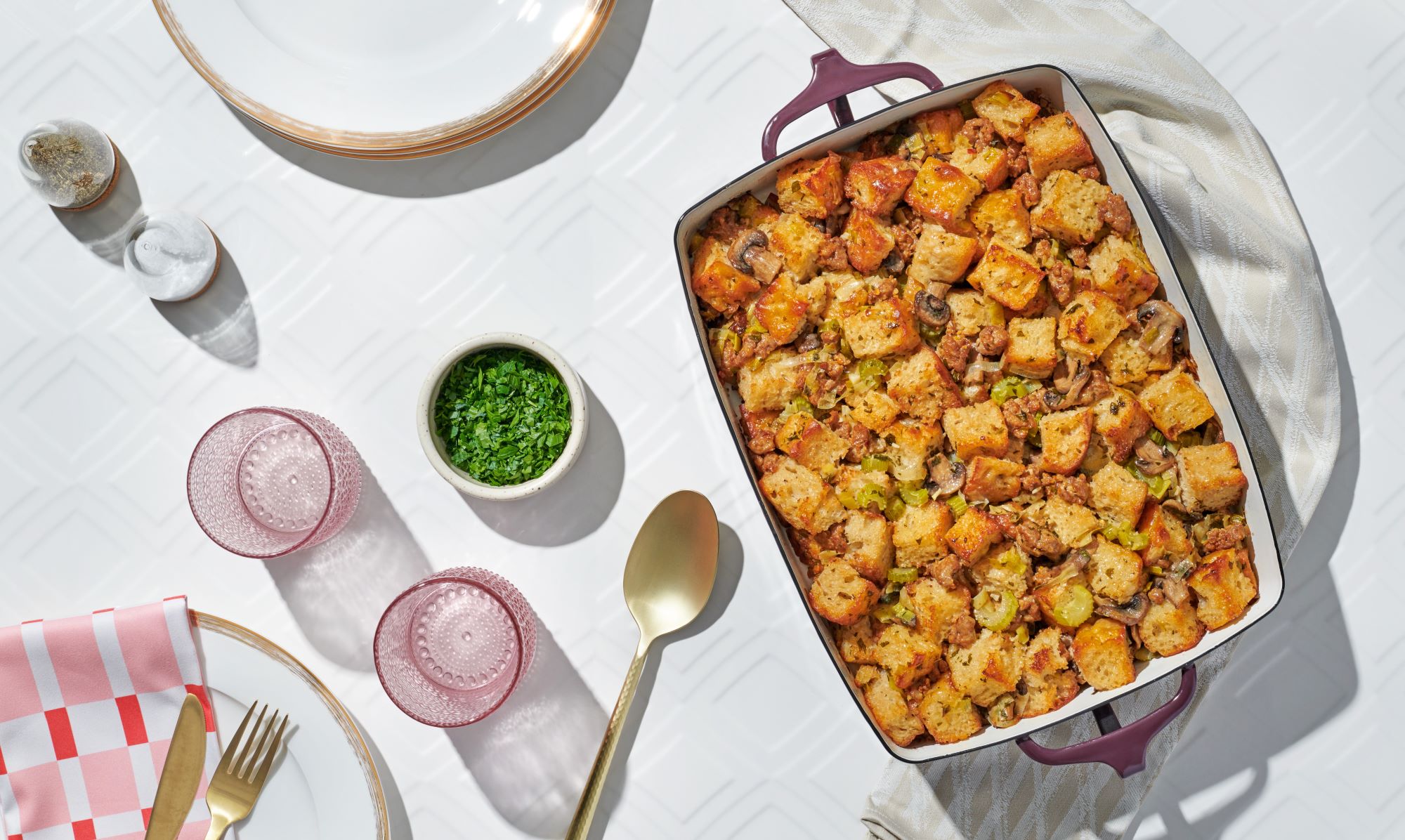 An image of prepared Focaccia Stuffing with Mushrooms & Leeks made with focaccia bread, pork sausage, baby bella mushrooms, celery, leeks, Pacific Foods® Organic Free Range Chicken Broth and parsley.