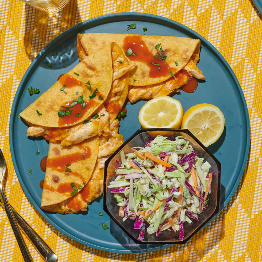 An image of prepared Crispy Buffalo Chicken Tacos made with chicken, Pacific Foods® Condensed Cream of Celery Soup, Buffalo hot wing sauce, corn tortillas and blue cheese dressing.