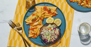 An image of prepared Crispy Buffalo Chicken Tacos made with chicken, Pacific Foods® Condensed Cream of Celery Soup, Buffalo hot wing sauce, corn tortillas and blue cheese dressing.
