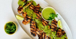 An image of prepared Peruvian Chicken with Aji Verde Sauce made with Pacific Foods® Organic Condensed Cream of Celery Soup, honey, chicken, jalapeño peppers and cilantro.