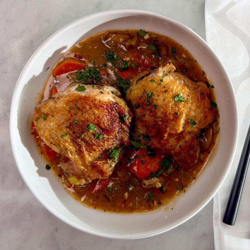 An image of prepared Creamy Chicken & Mushroom Fricassee made with chicken thighs and drumsticks, white wine, Pacific Foods® Organic Free Range Chicken Broth, Pacific Foods® Organic Cream of Mushroom Condensed Soup, carrots, celery and onion.