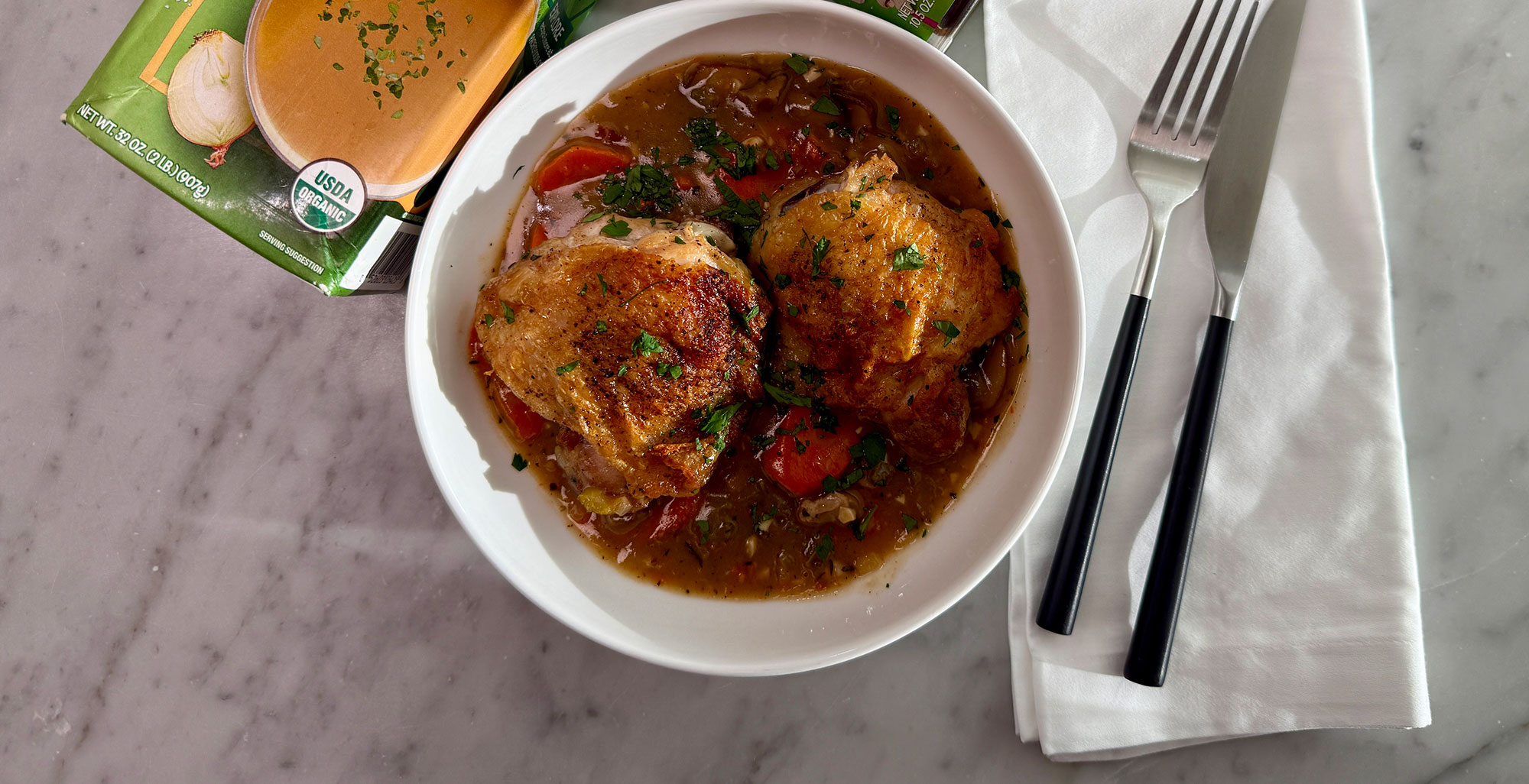 An image of prepared Creamy Chicken & Mushroom Fricassee made with chicken thighs and drumsticks, white wine, Pacific Foods® Organic Free Range Chicken Broth, Pacific Foods® Organic Cream of Mushroom Condensed Soup, carrots, celery and onion.