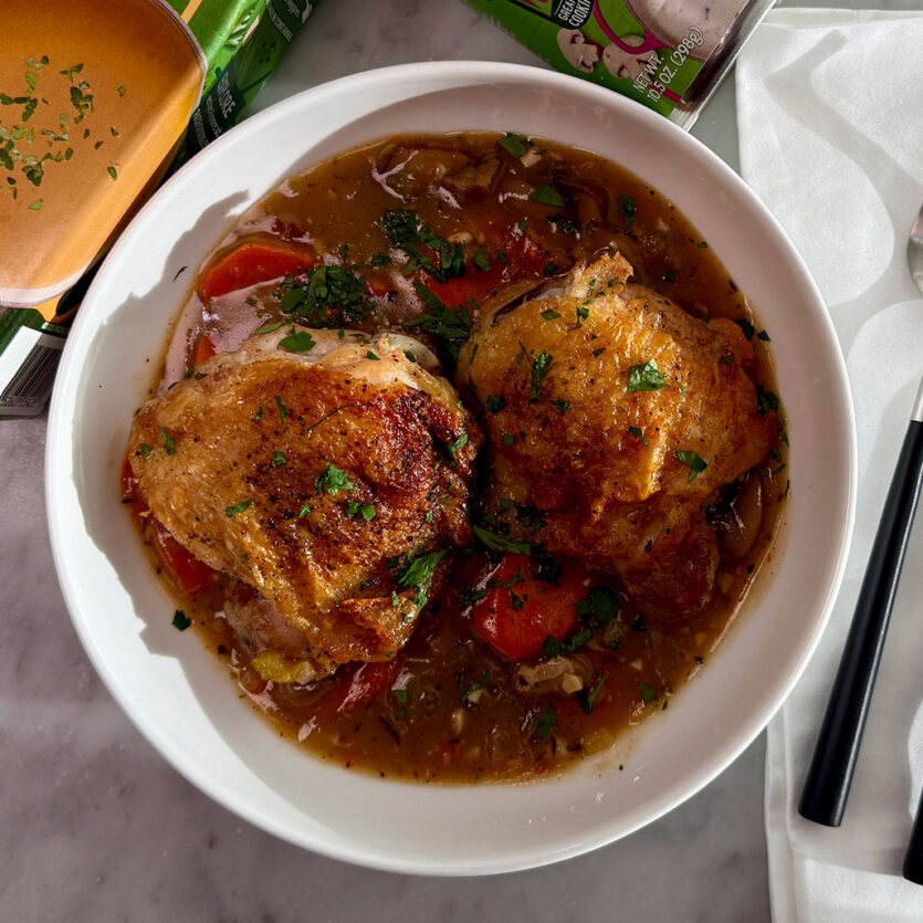 An image of prepared Creamy Chicken & Mushroom Fricassee made with chicken thighs and drumsticks, white wine, Pacific Foods® Organic Free Range Chicken Broth, Pacific Foods® Organic Cream of Mushroom Condensed Soup, carrots, celery and onion.