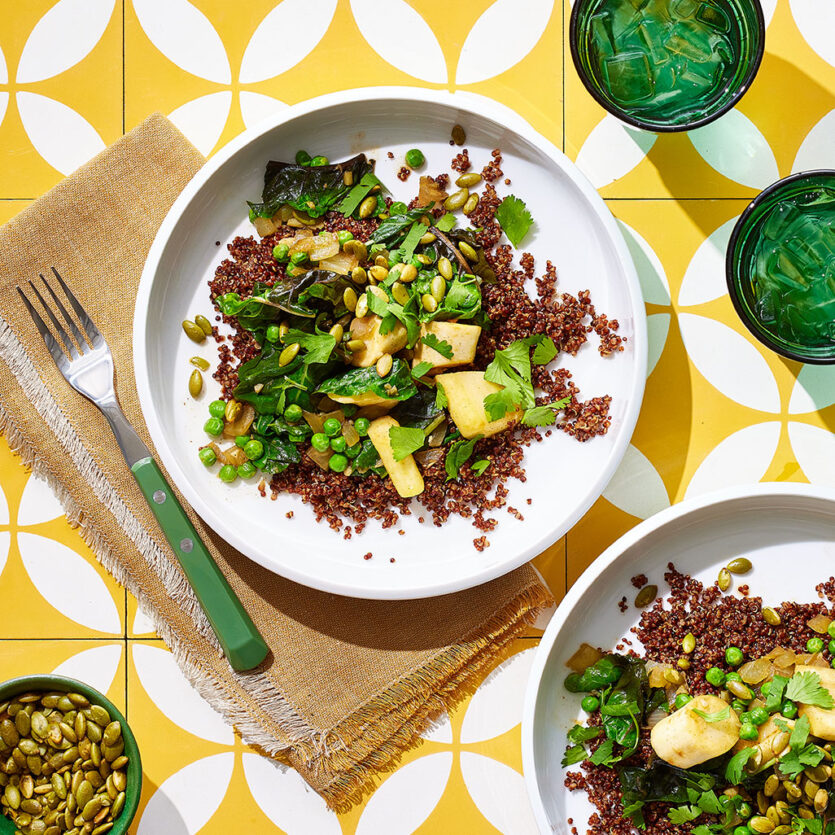 An image of prepared Quinoa Masala with Parsnips and Swiss Chard made with Pacific Foods® Organic Low Sodium Vegetable Broth, quinoa, parsnips, onion, ginger, Swiss chard, peas and pumpkin seeds.