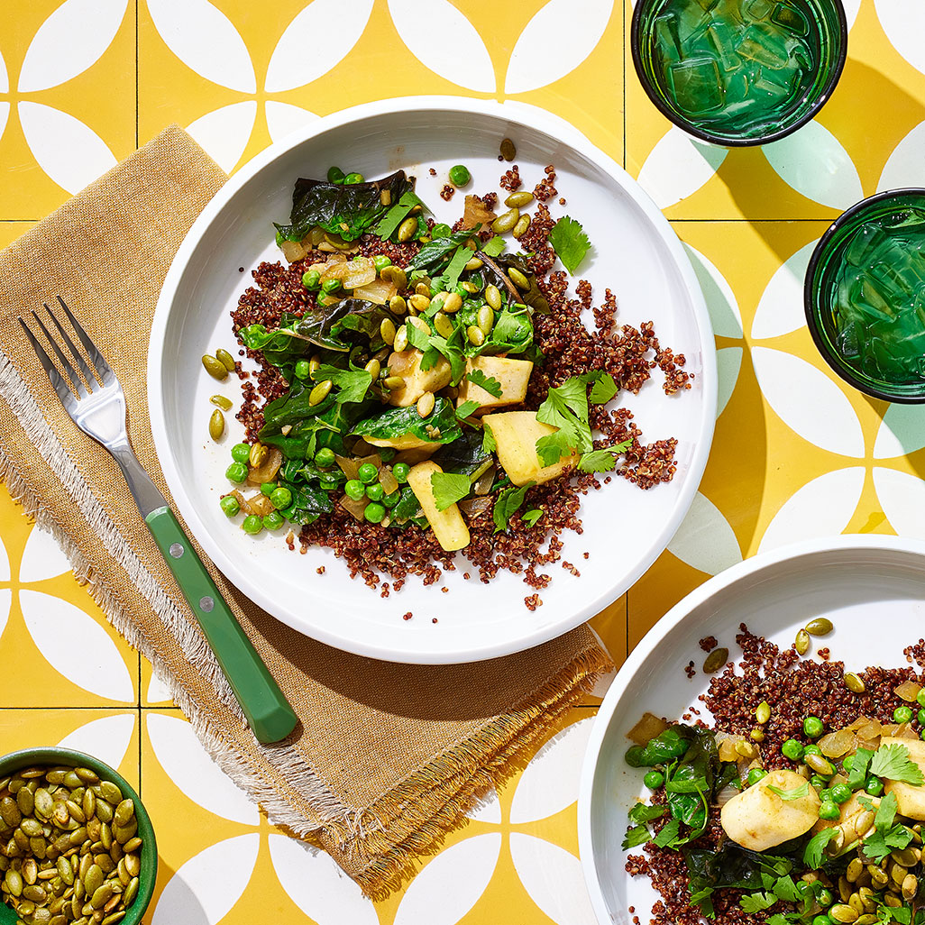 An image of prepared Quinoa Masala with Parsnips and Swiss Chard made with Pacific Foods® Organic Low Sodium Vegetable Broth, quinoa, parsnips, onion, ginger, Swiss chard, peas and pumpkin seeds.