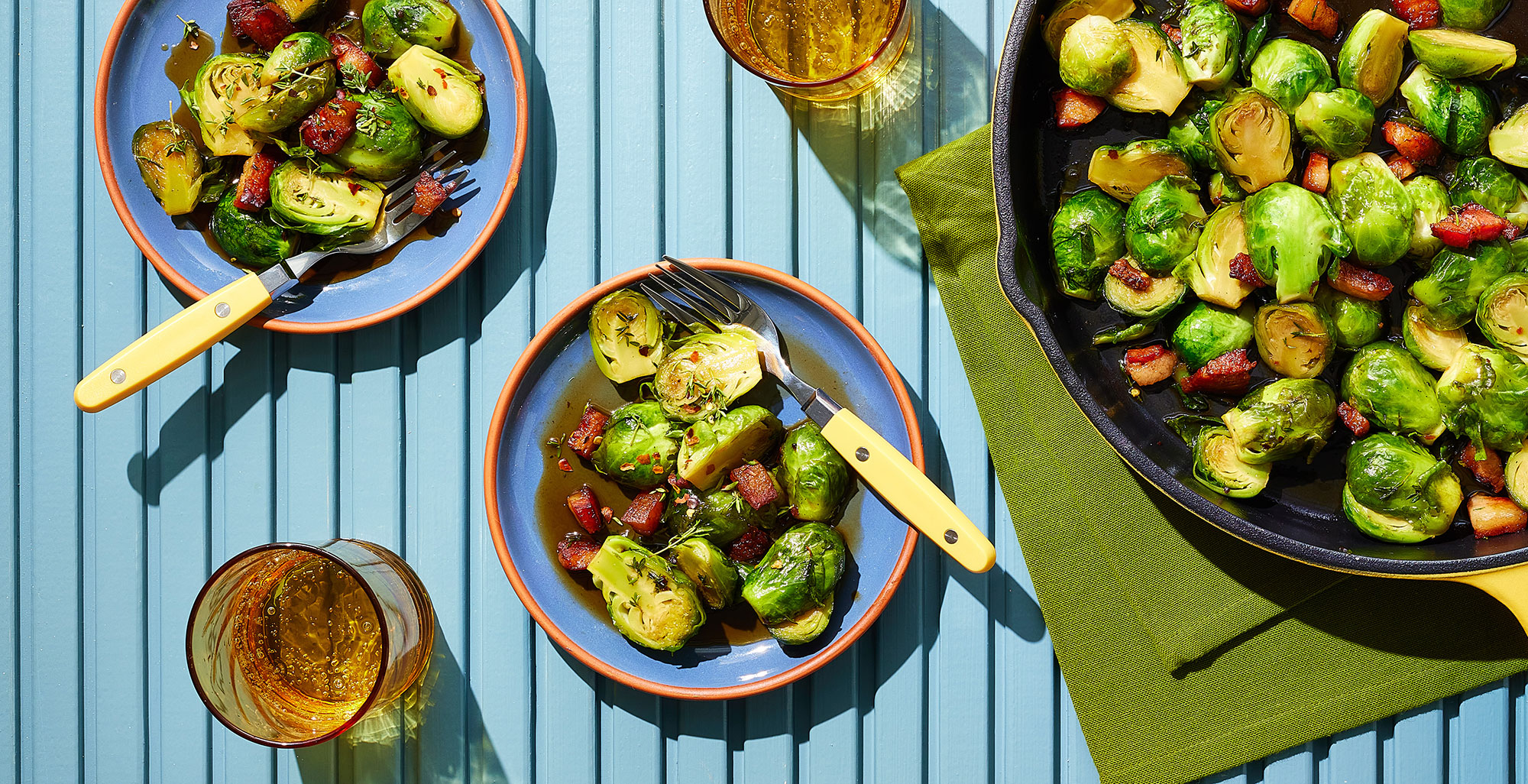An image of prepared Bourbon Glazed Brussels Sprouts made with pancetta, Brussels sprouts, Pacific Foods® Organic Free Range Chicken Broth, brown sugar, bourbon, thyme and red pepper flakes.