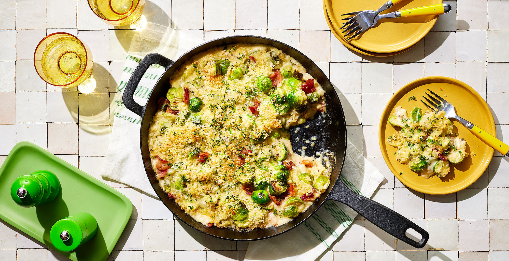 An image of prepared Creamy Brussels Sprouts Gratin made with bacon, Brussels sprouts, thyme, garlic, Pacific Foods® Organic Cream of Mushroom Condensed Soup, cream, Gruyère and Parmesan.