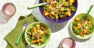 An image of prepared Farro and Roasted Vegetable Bone Broth Bowl made with Pacific Foods® Organic Chicken Bone Broth with Sea Salt, farro, sweet potato, parsnips, baby arugula, feta cheese and mint.