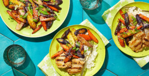 An image of prepared Roasted Carrots with Bone Broth and Maple made with rainbow carrots, Pacific Foods® Organic Unsalted Chicken Bone Broth, butter, maple syrup, white miso paste, Dijon and black pepper.