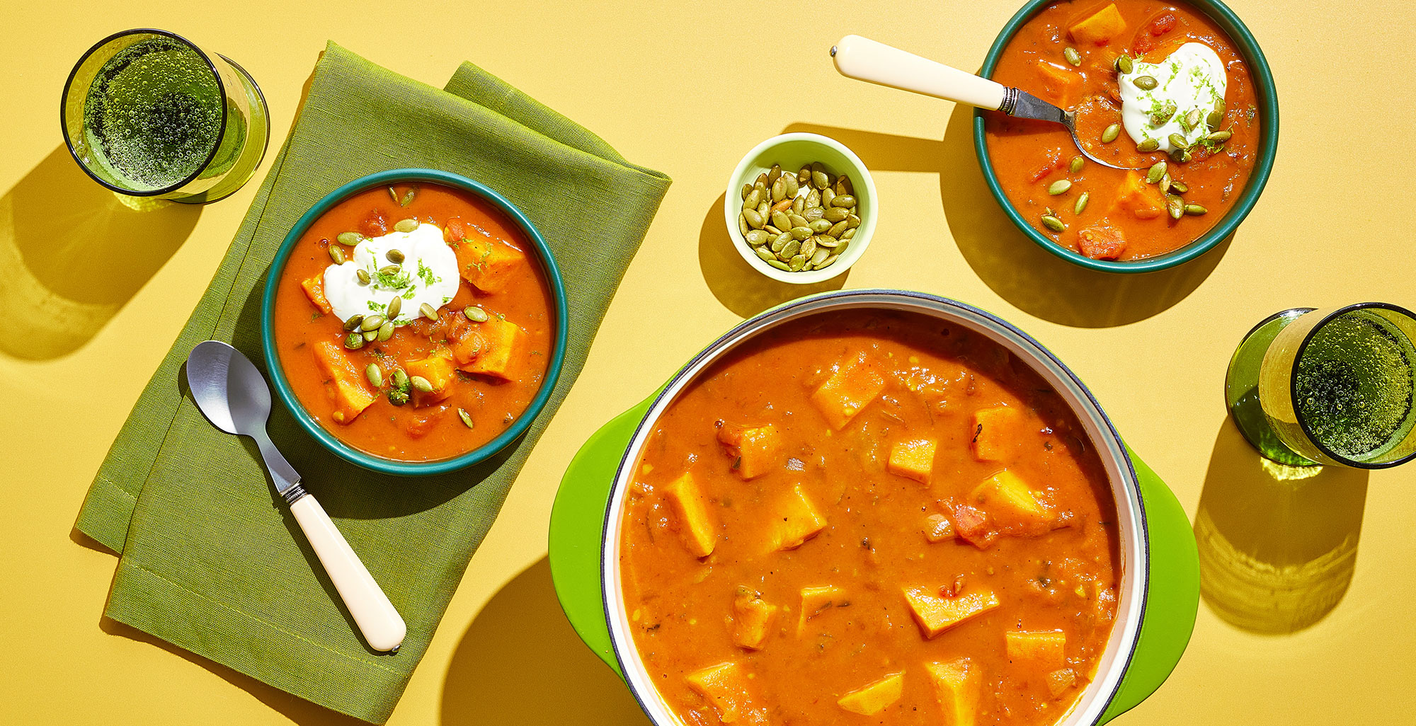 An image of prepared Spicy Sweet Potato Chipotle Soup made with yellow onions, poblano, sweet potato, Pacific Foods® Organic Chicken Bone Broth, fire roasted tomatoes, chipotles in adobo, sour cream and pumpkin seeds.