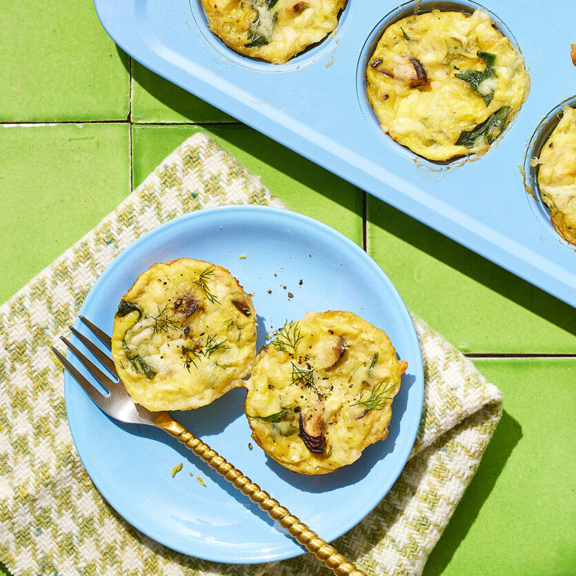 An image of prepared Spinach and Mushroom Egg Bites made with mixed wild mushrooms, baby spinach, eggs, Pacific Foods® Organic Cream of Mushroom Condensed Soup, dill, feta cheese and fontina cheese.