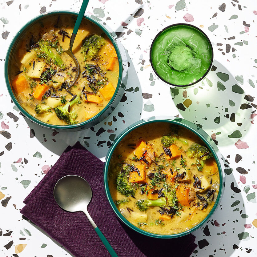 An image of prepared Vegan Broccoli Potato Soup made with Pacific Foods® Organic Low Sodium Vegetable Broth, wild rice, sweet potato, parsnips, broccoli and Pacific Foods™ Hemp Original Plant-Based Beverage.