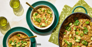 An image of prepared White Turkey Chili with Corn made with cumin, chili powder, turkey tenderloin, onion, corn, Pacific Foods® Organic Turkey Broth, pinto beans, green chiles and corn tortillas.