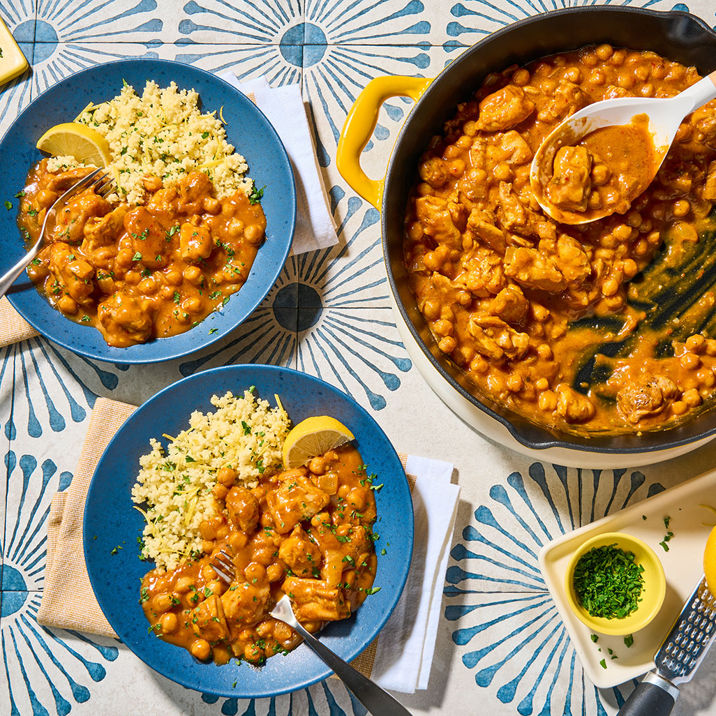An image of prepared Butternut Harissa Chicken with Couscous made with chicken, za'atar seasoning, onion, Pacific Foods® Organic Butternut Squash Soup with Cinnamon and Nutmeg, chickpeas, cilantro, couscous and Pacific Foods® Organic Free Range Chicken Broth.
