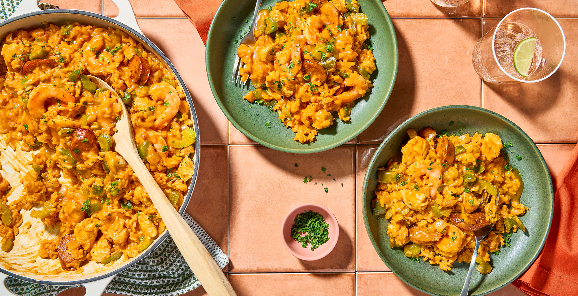An image of prepared Creamy One-Pot Risotto-Style Jambalaya made with chicken, Cajun seasoning, andouille sausage, white rice, Pacific Foods® Organic Low Sodium Free Range Chicken Broth, Pacific Foods® Organic Spicy Garden Tomato Soup and shrimp.