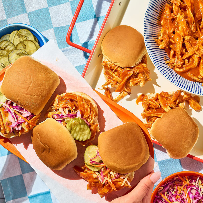 An image of prepared Slow Cooker Hot Honey BBQ Chicken Sliders made with chicken, Pacific Foods® Organic Condensed Tomato Soup and Pepperidge Farm® White Slider Buns.