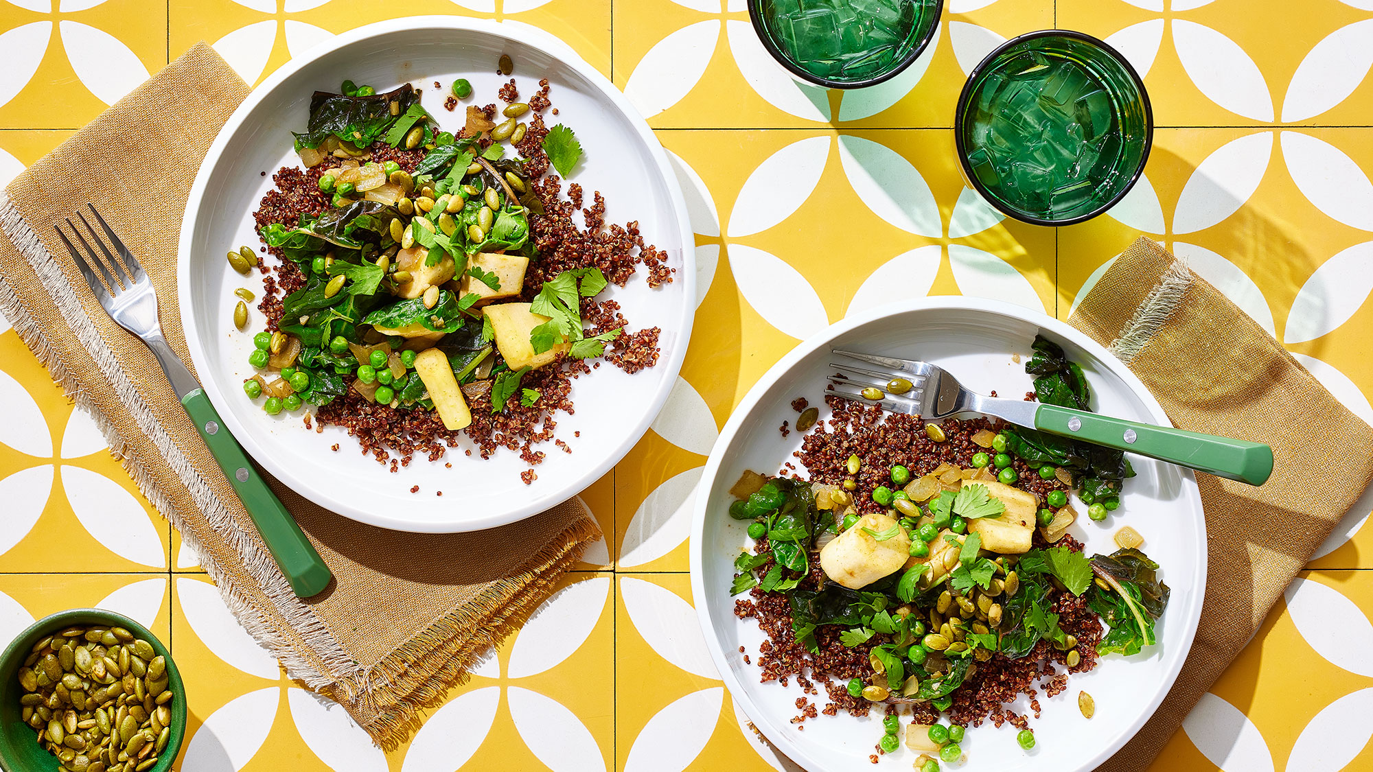 An image of prepared Quinoa Masala with Parsnips and Swiss Chard made with Pacific Foods® Organic Low Sodium Vegetable Broth, quinoa, parsnips, onion, ginger, Swiss chard, peas and pumpkin seeds.