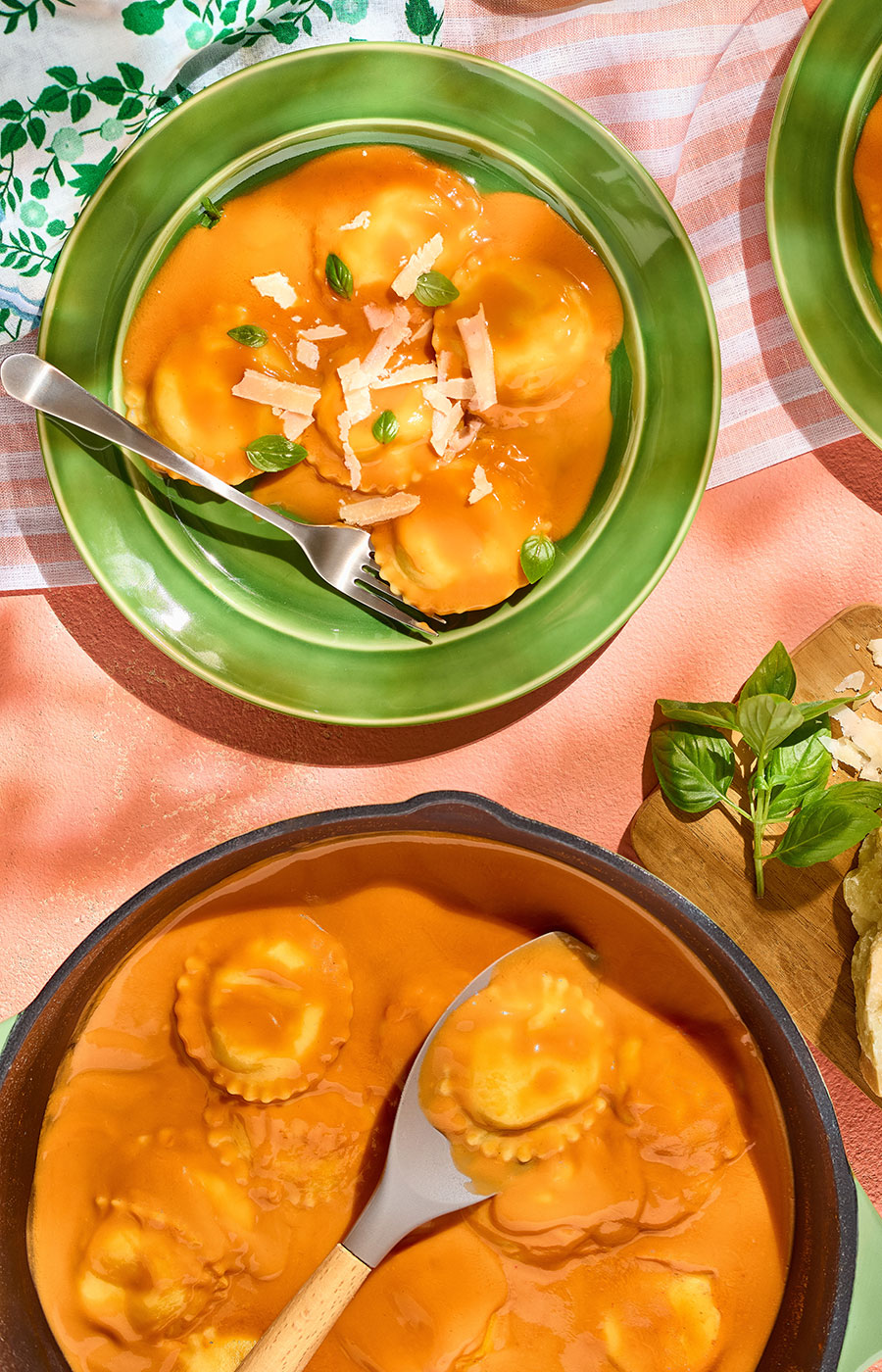 An image of prepared 3-Ingredient Creamy Tomato Basil Ravioli made with Pacific Foods™ Organic Vegan Creamy Tomato Basil Soup, cheese ravioli and Parmesan cheese.