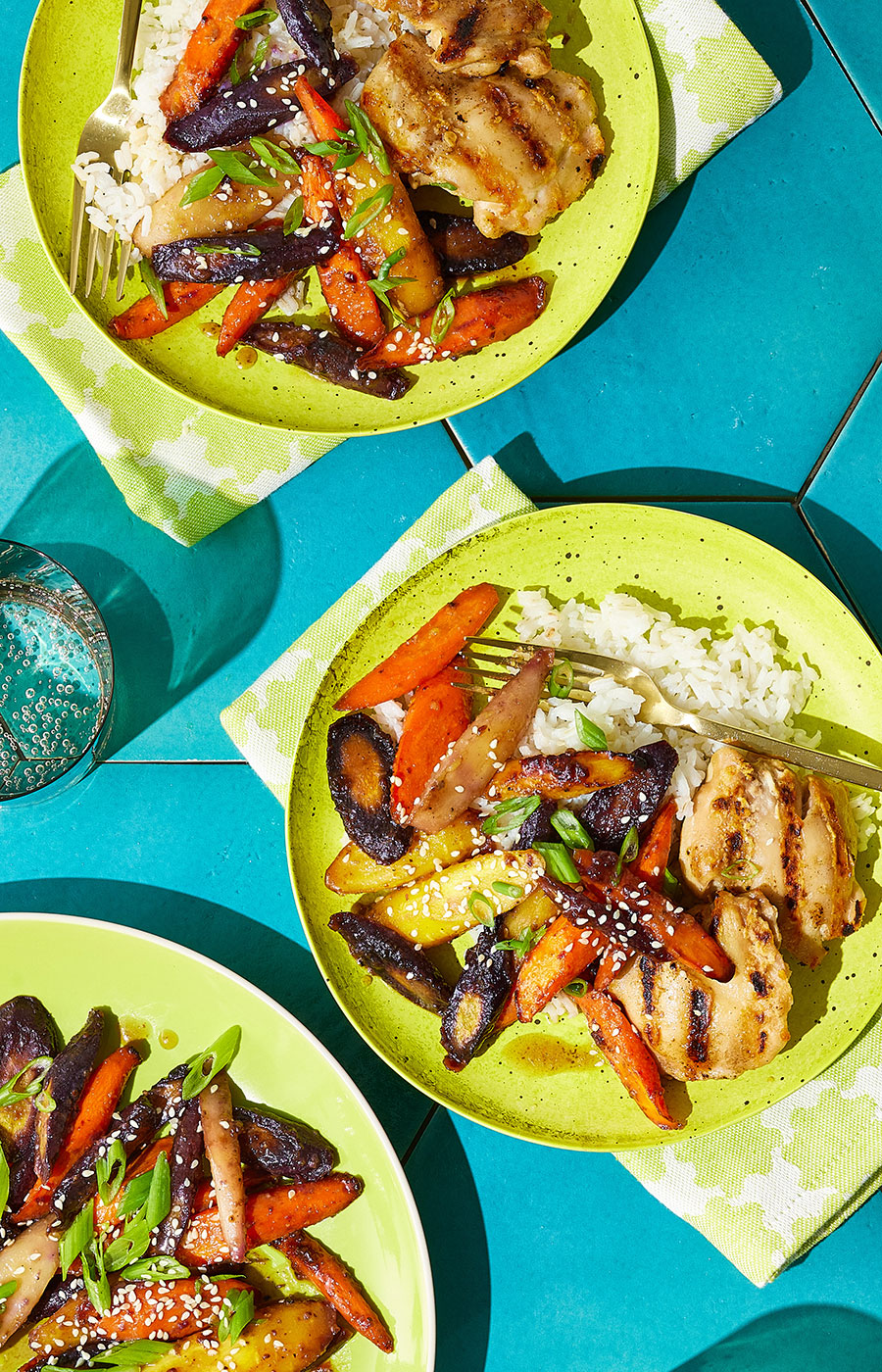 An image of prepared Roasted Carrots with Bone Broth and Maple made with rainbow carrots, Pacific Foods® Organic Unsalted Chicken Bone Broth, butter, maple syrup, white miso paste, Dijon and black pepper.