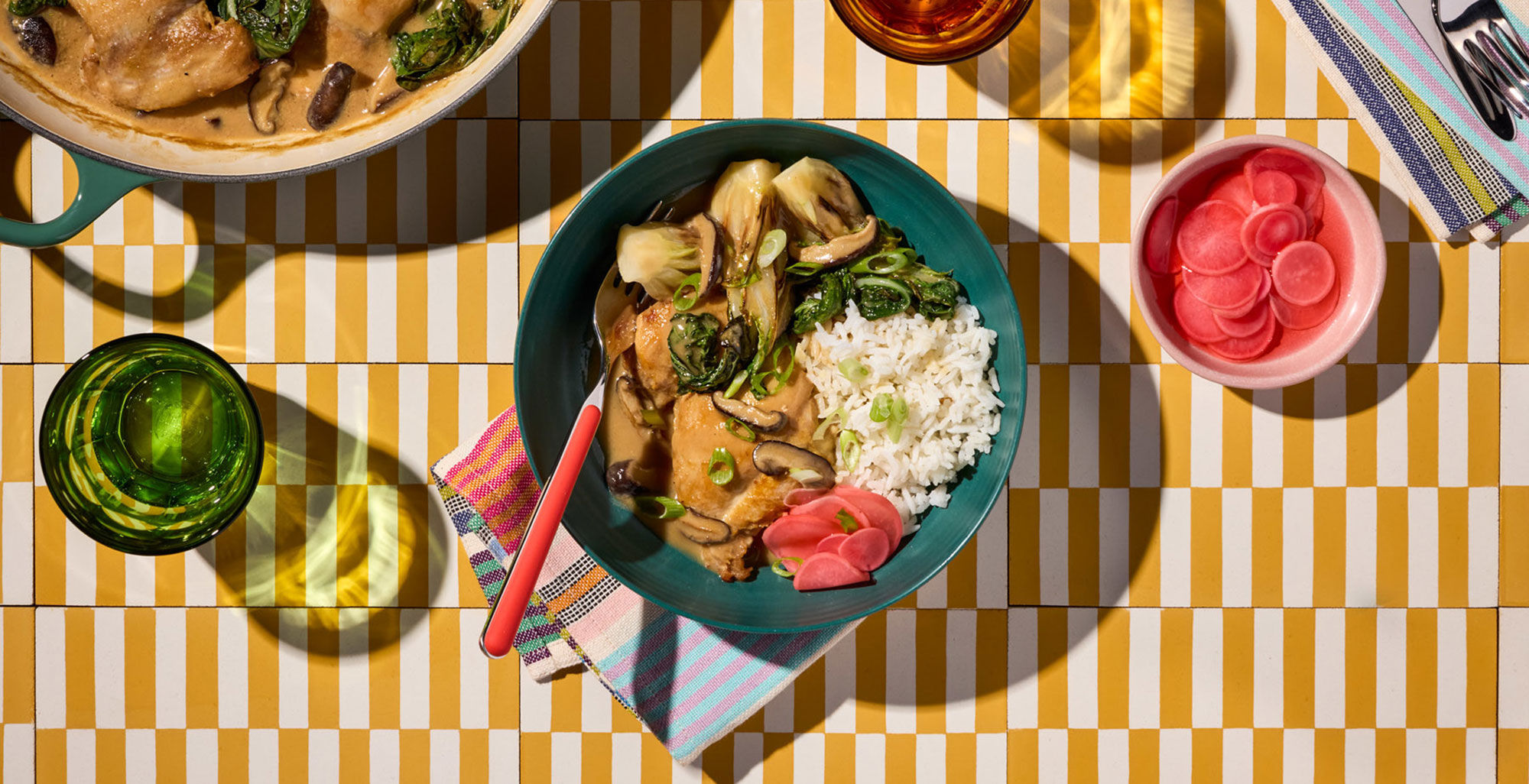 An image of prepared Braised Miso Chicken with Shiitakes and Baby Bok Choy made with chicken thighs, shiitake mushrooms, baby bok choy, Pacific Foods® Organic Chicken Miso Ramen Broth and rice.